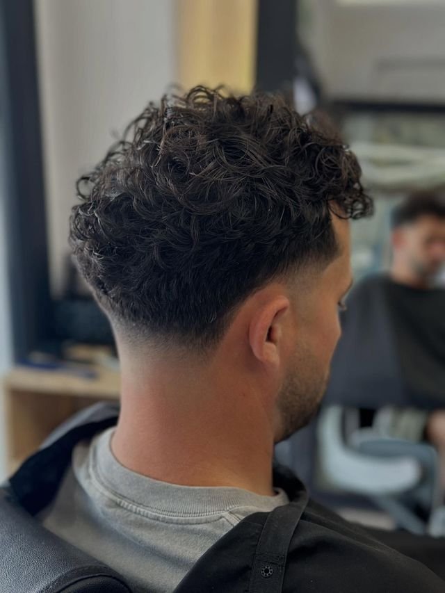 Fade y textura rizada realizado en Baires